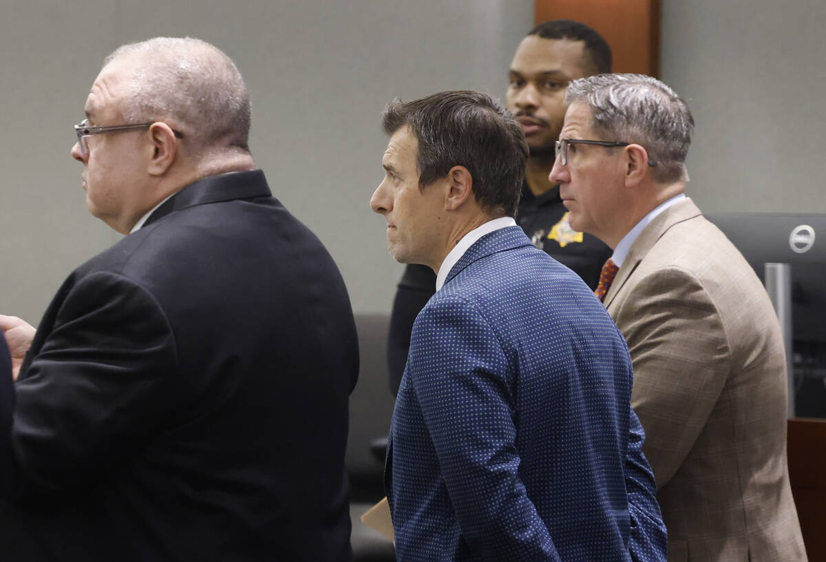 Frank Mariani, center, a former Boulder City High School football coach who is accused of lewdn ...