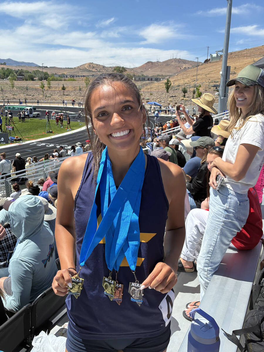 Photo courtesy Mark Misuraca Sancha Jenas-Keogh shows off her medals at this past weekend's tr ...