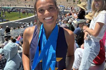 Photo courtesy Mark Misuraca Sancha Jenas-Keogh shows off her medals at this past weekend's tr ...