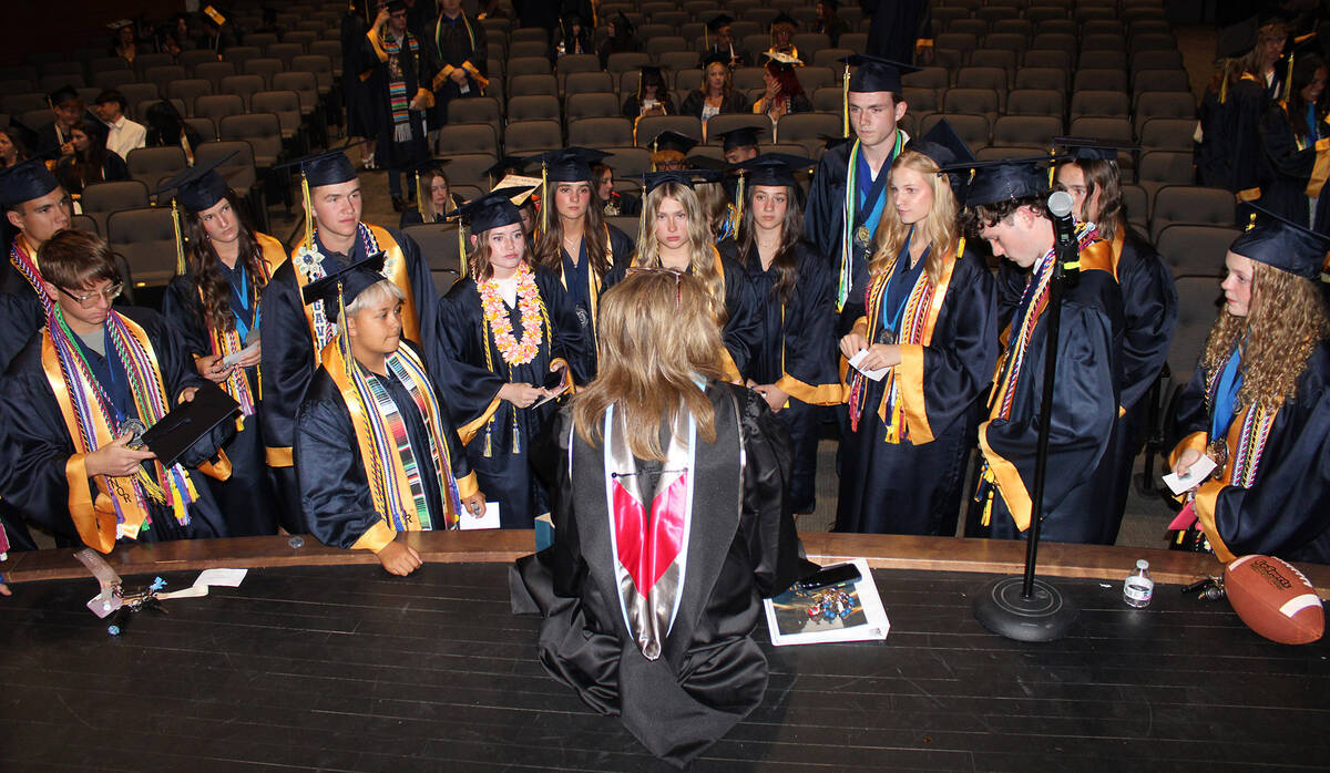BCHS Principal Amy Wagner, foreground, talks with those graduates who would later be on stage w ...