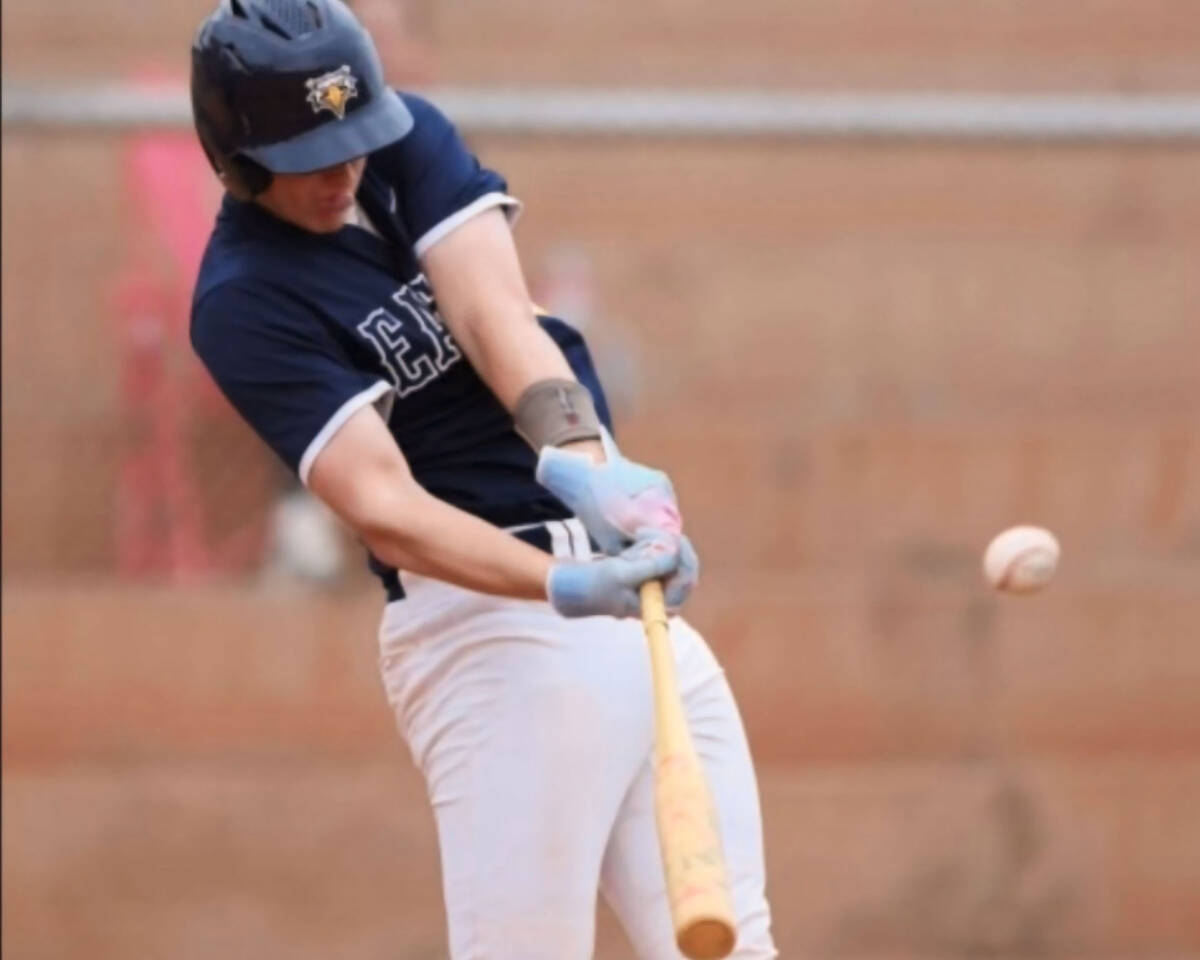 Photo courtesy Cael Starley Boulder City's Spencer Aten puts the ball in play for the Eag ...