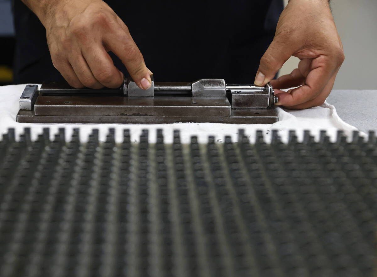 Carlos Sifuentes assembles the CH4 pens at the Fisher Space Pen factory, on May 13, 2026, in Bo ...