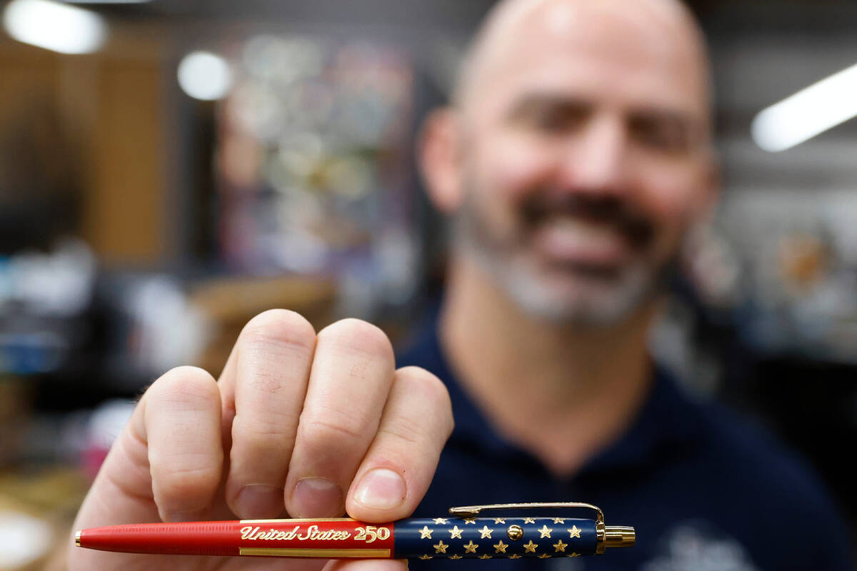 Matt Fisher, VP of Fisher Space Pen, holds a patriotic special edition pen, celebrating the 250 ...
