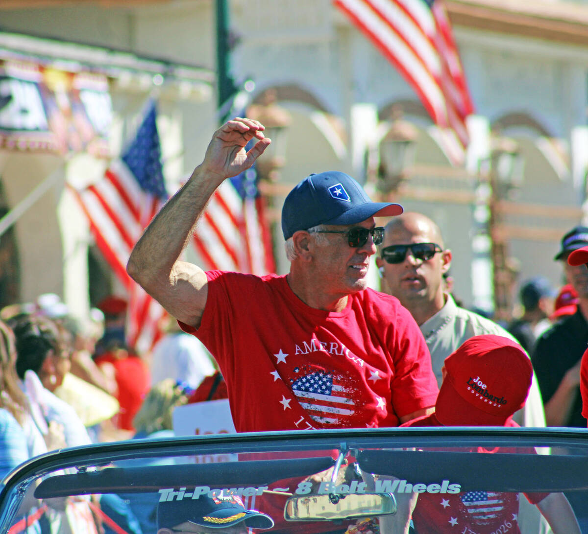 Gov. Joe Lombardo waves to the crowd during the parade. Lt. Gov. Stavros Anthony was in town la ...