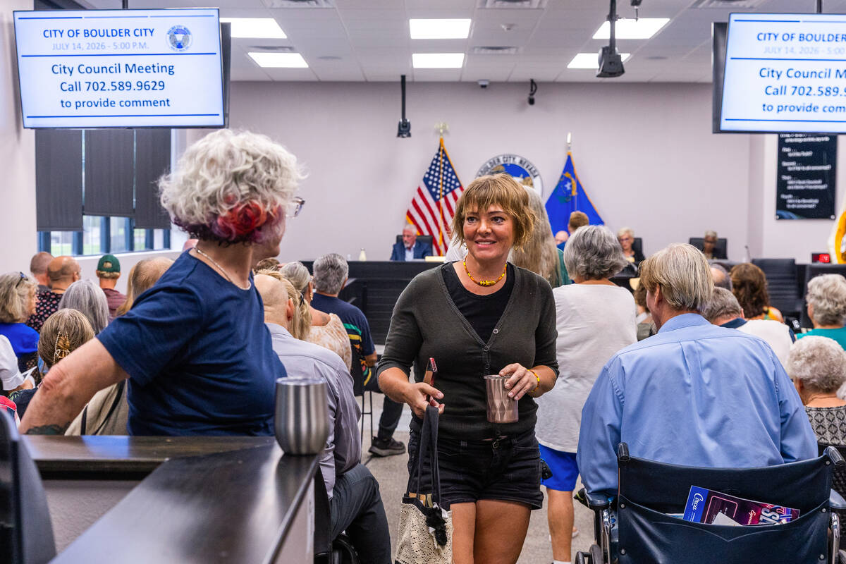 Community members Brenda Laurel and Brynn DeLorimier come together after speaking before the Bo ...
