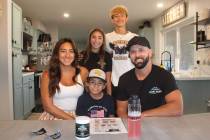 Ron Eland/Boulder City Review Anabel and Alex Smith in their Boulder City home with their three ...