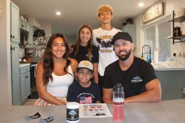 Ron Eland/Boulder City Review Anabel and Alex Smith in their Boulder City home with their three ...