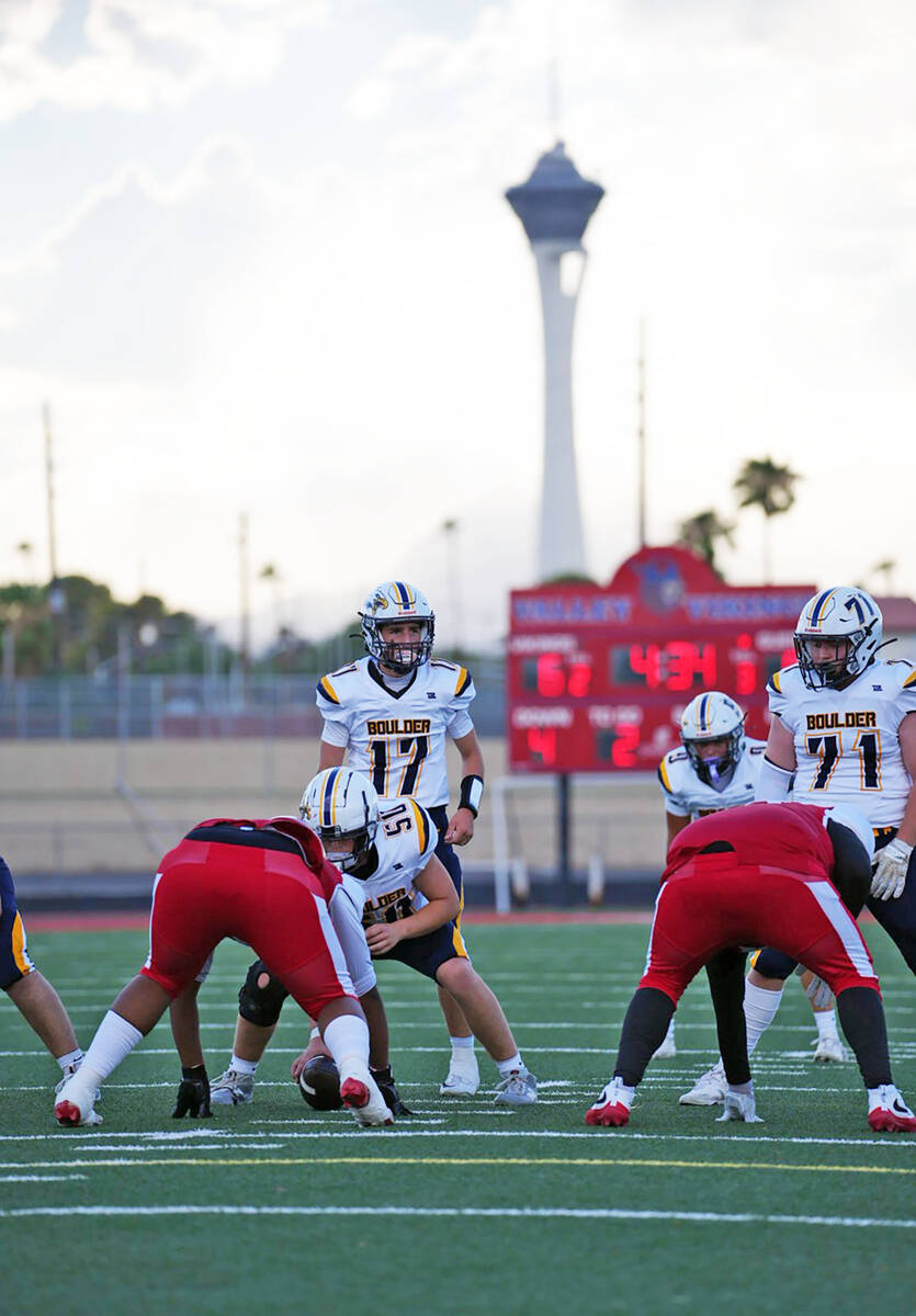 Photo courtesy Cade Braden BCHS quarterback Logan Swift gets ready to take a snap from center K ...