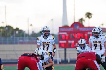 Photo courtesy Cade Braden BCHS quarterback Logan Swift gets ready to take a snap from center K ...