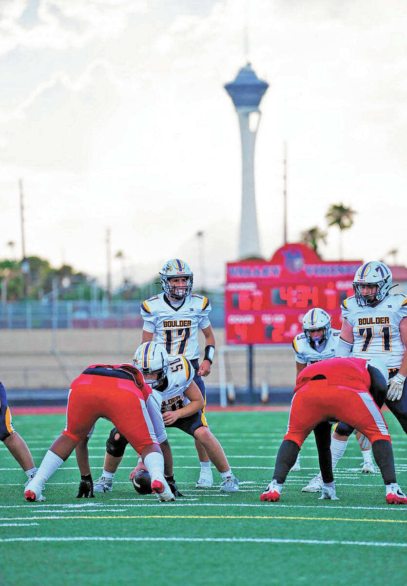 Photo courtesy Cade Braden BCHS quarterback Logan Swift gets ready to take a snap from center K ...