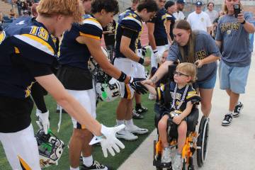 Ron Eland/Boulder City Review Four-year-old Grayson Armstrong, with his parents, Jessica and Rh ...