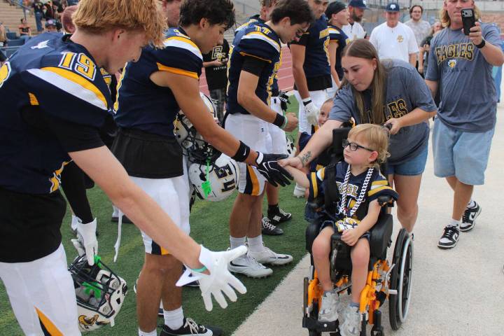 Ron Eland/Boulder City Review Four-year-old Grayson Armstrong, with his parents, Jessica and Rh ...