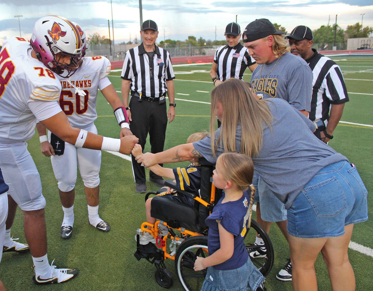 Ron Eland/Boulder City Review During the pregame coin toss, Grayson Armstrong got fist bumps fr ...
