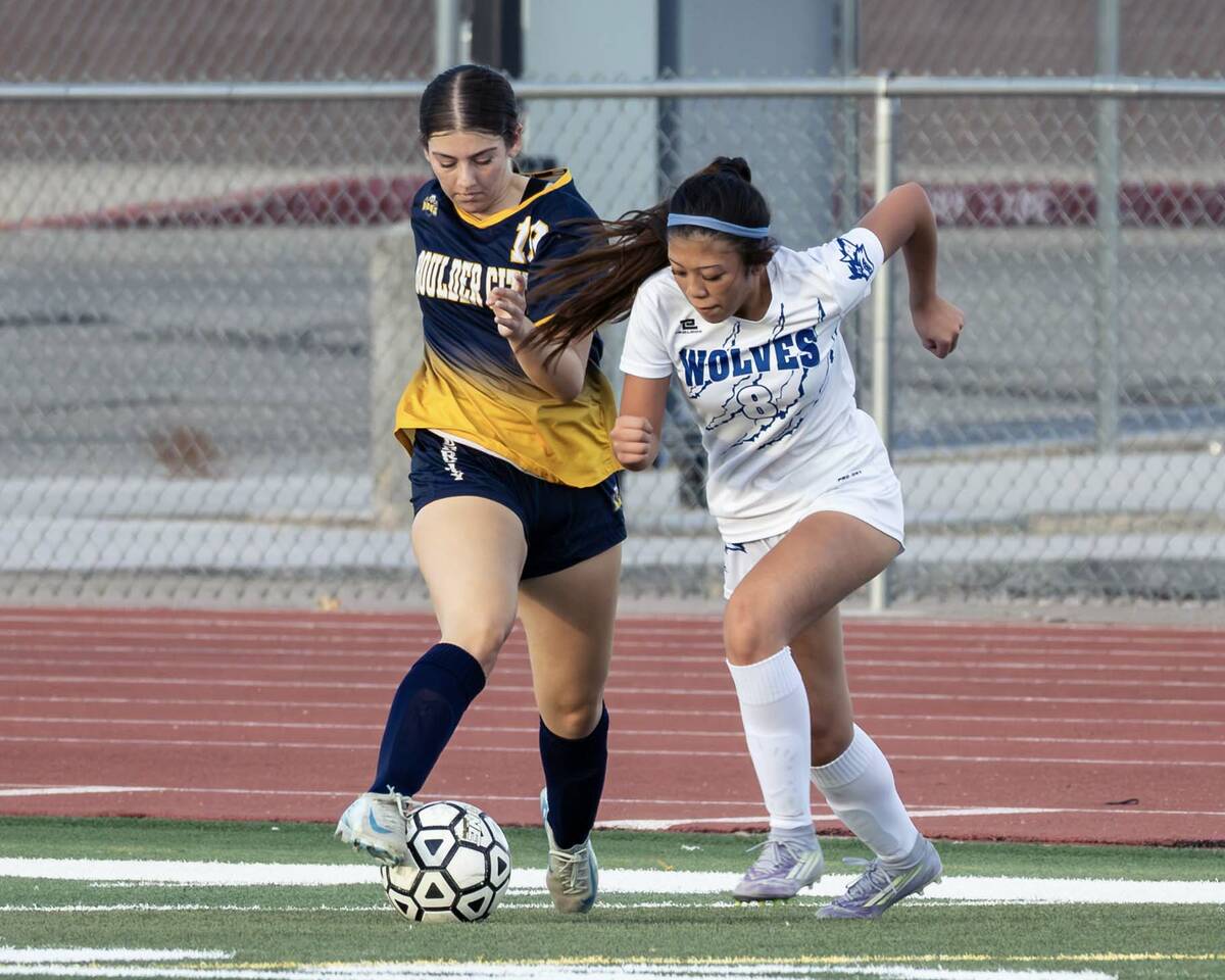 Photo courtesy Chad Schoop Boulder City's Kora Remedi battles with a Basic player for positioni ...