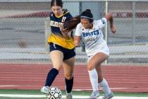 Photo courtesy Chad Schoop Boulder City's Kora Remedi battles with a Basic player for positioni ...