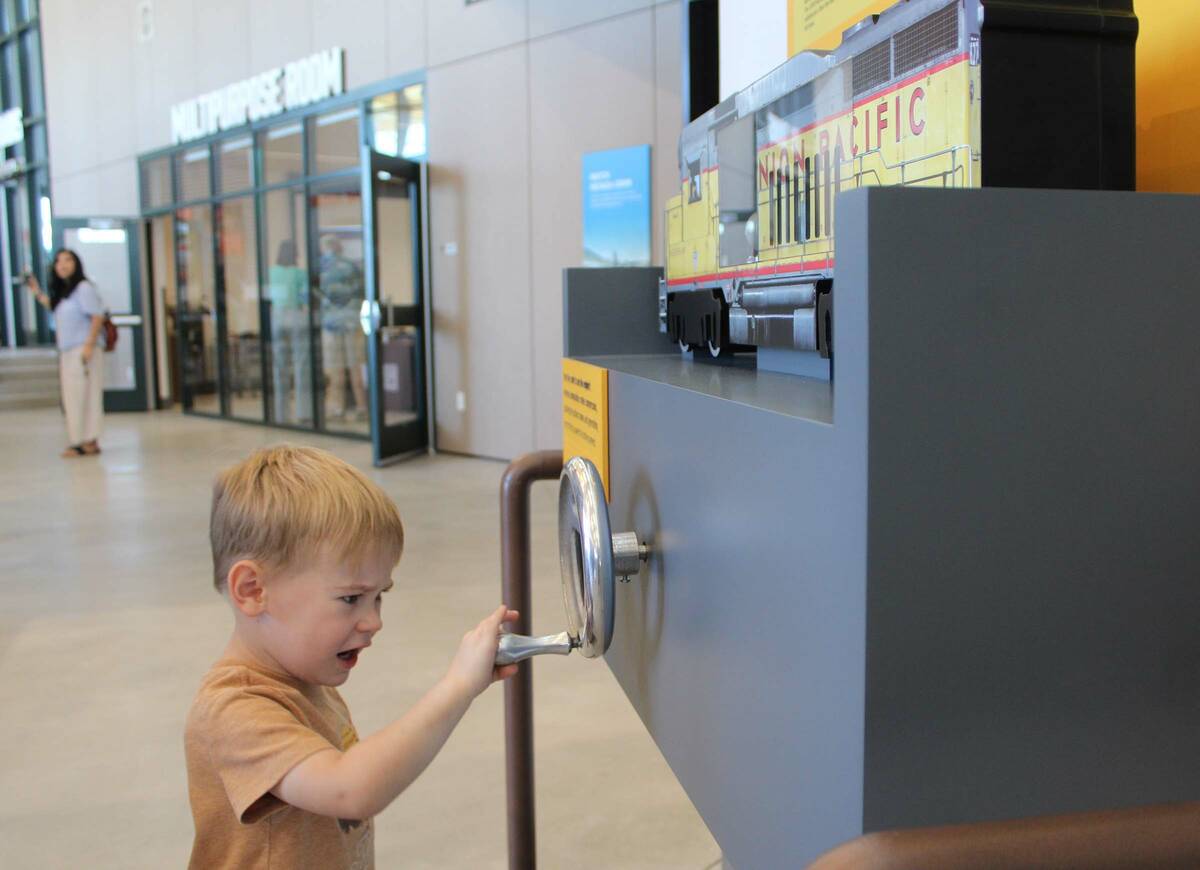 Ron Eland/Boulder City Review Three-year-old Robert Robinson gives it his all to crank a train ...