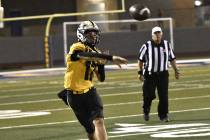 Robert Vendettoli/Boulder City Review Looking downfield, Boulder City quarterback Logan Swint t ...