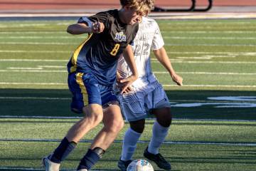 Photo courtesy Chad Schoop Boulder City boys soccer star Kayden Wells takes the ball away from ...