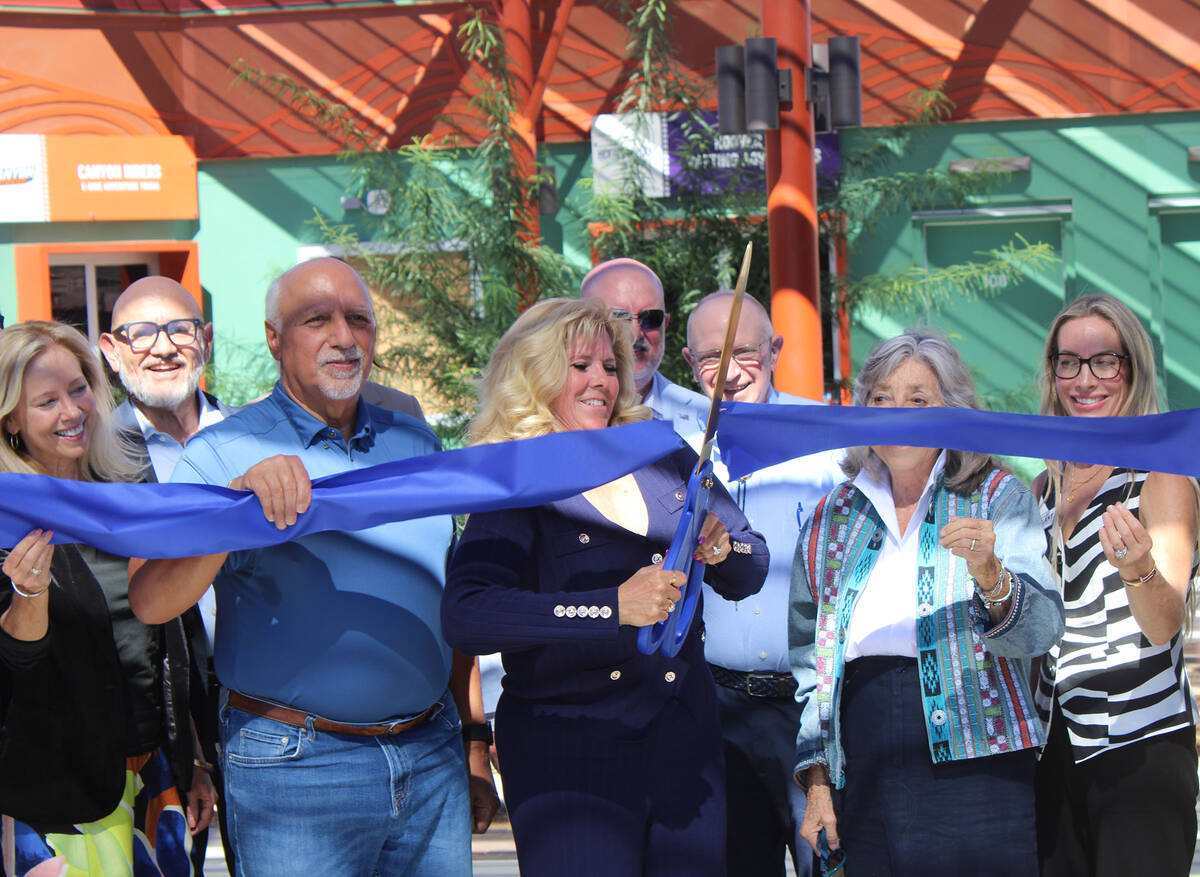 Ron Eland/Boulder City Review Flanked by state and local elected officials and invited guests, ...