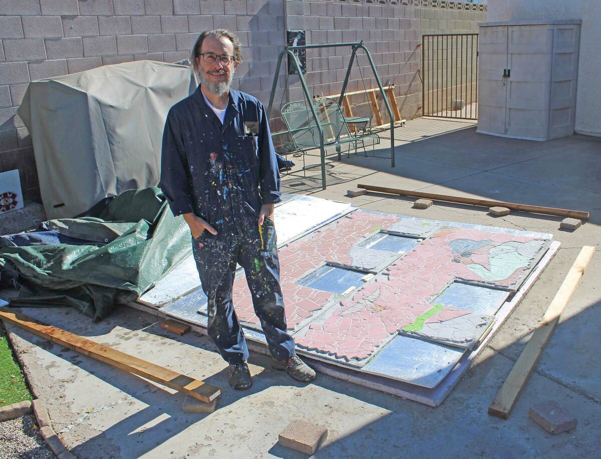 Ron Eland/Boulder City Review Boulder City artist Lee Lanier stands in his backyard next to one ...