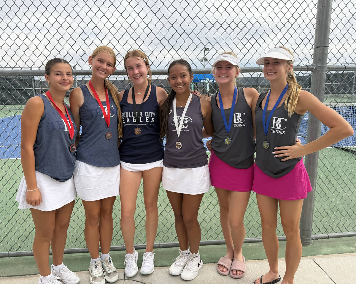 Boulder City High School girls tennis players, from left, Quinn Gibson, Harmony Cook, ...