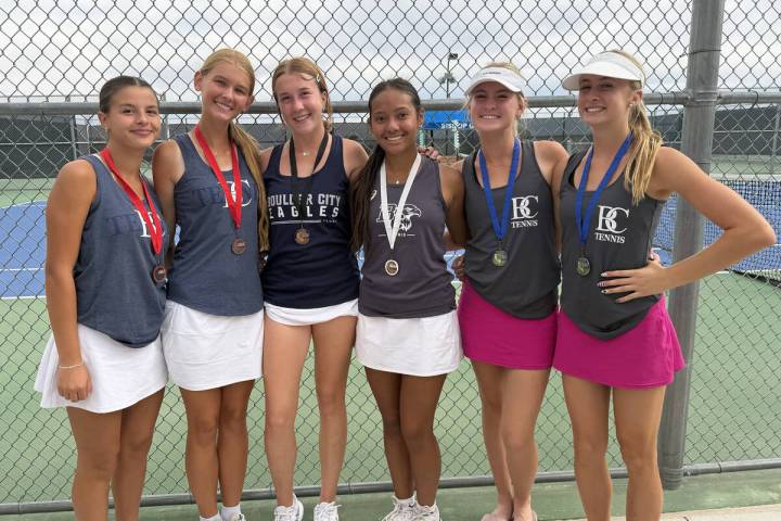 Boulder City High School girls tennis players, from left, Quinn Gibson, Harmony Cook, ...