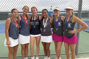 Boulder City High School girls tennis players, from left, Quinn Gibson, Harmony Cook, ...
