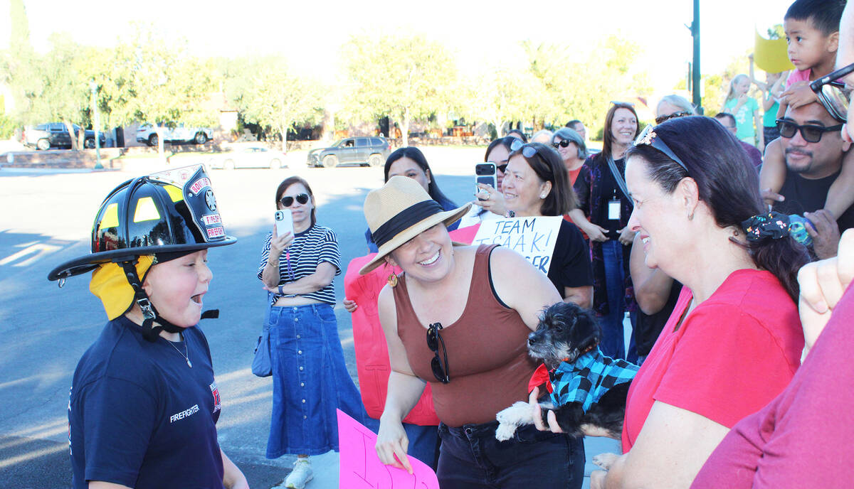 Upon arrival at Bicentennial Park, Isaak Oddieo was presented with a new puppy named Sammi, muc ...
