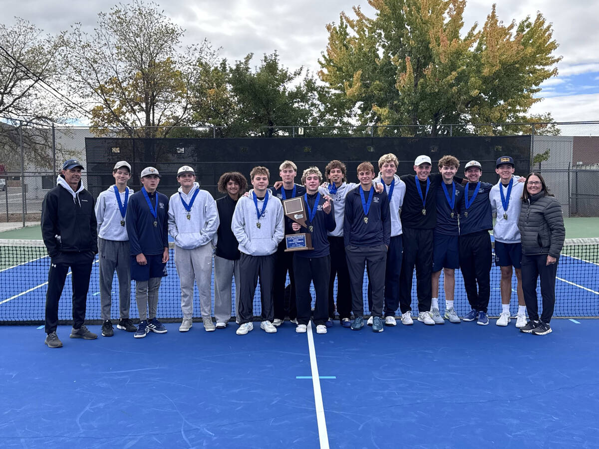 Boulder City High School boys tennis celebrates winning their second consecutive 3A state champ ...