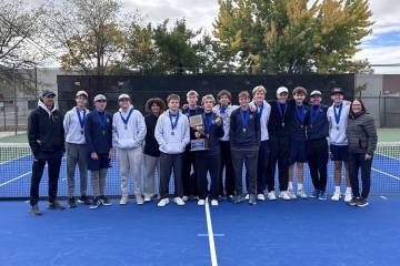 Boulder City High School boys tennis celebrates winning their second consecutive 3A state champ ...